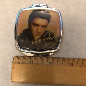 NWT compact mirror with Elvis Presley on front, sliver color back, magnify & reg